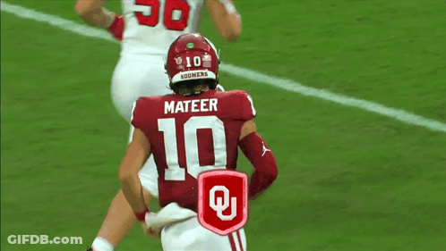 Women Dancing In Field With Mascot Wearing Oklahoma Shirt GIF