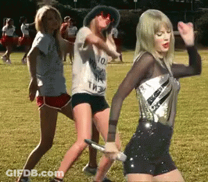 Women Dancing In Field With Taylor Swift Shirt GIF