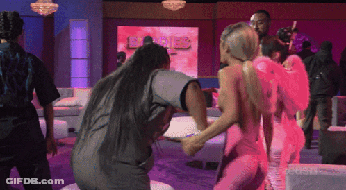 Women Dancing In Front Of Angels Sign GIF