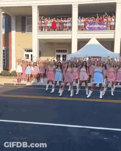 Women Dancing In Front Of Lulugang Sign GIF