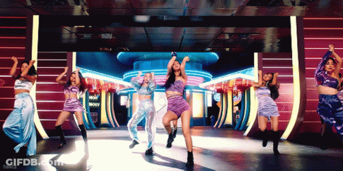 Women Dancing In Front Of Now Show Sign GIF