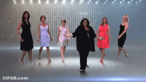Women Dancing In Front Of Wall Of Lights GIF