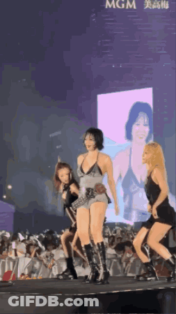 Women Dancing On Stage In Front Of MGM Screen GIF
