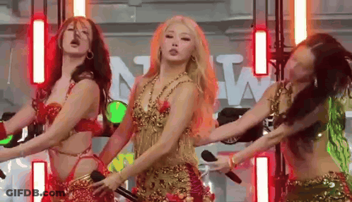 Women Dancing On Stage With Microphone GIF