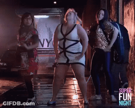 Women Dancing On Wet Sidewalk In Dark Alley GIF