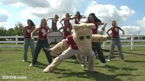 Women Dancing With Mascot Saying Oklahoma GIF
