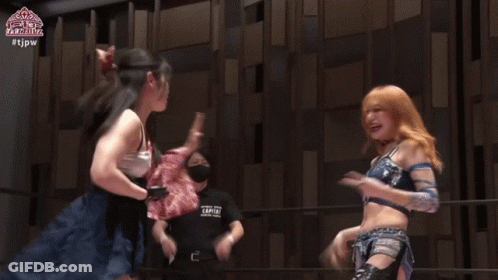 Women Holding Championship Belt On Stage GIF