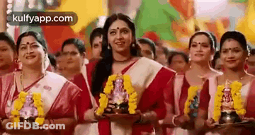 Women Holding Ganesha Statue GIF