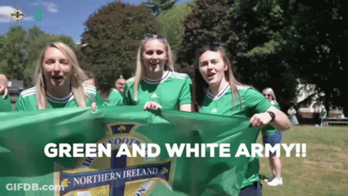 Women Holding Green And White Flag Saying Green And White Army GIF