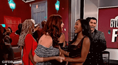 Women Hugging With Man Looking On GIF