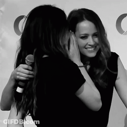 Women Hugging With Microphone GIF