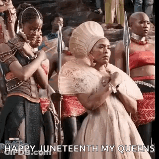 Women In Crowd Holding Spears GIF