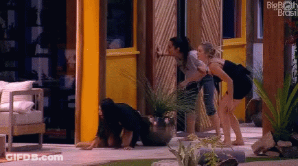 Women In Front Of Big Brother Brasil Building GIF
