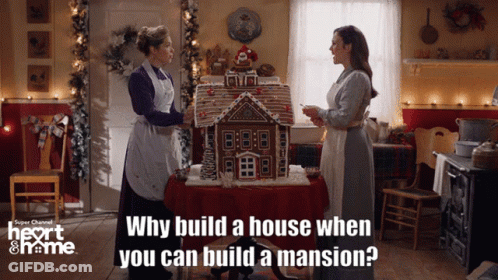 Women In Front Of Gingerbread House GIF