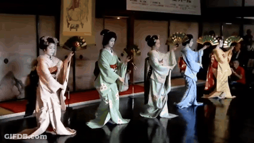 Women In Kimonos Dancing With Fans GIF
