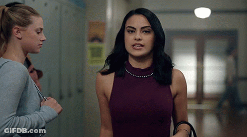 Women In Purple Tank Top In Hallway GIF