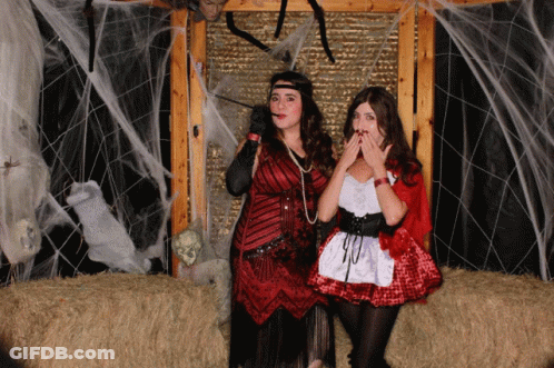 Women In Red And White Dresses Posing GIF
