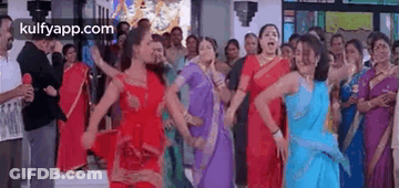 Women In Saris Dancing In Crowd GIF