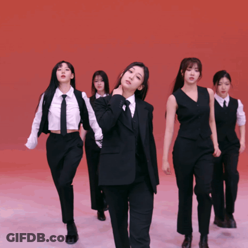 Women In Suits And Ties In Line GIF