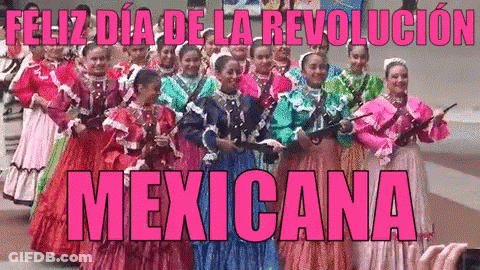 Women In Traditional Mexican Costumes Holding Guns GIF