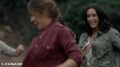 Women Laughing In Park GIF