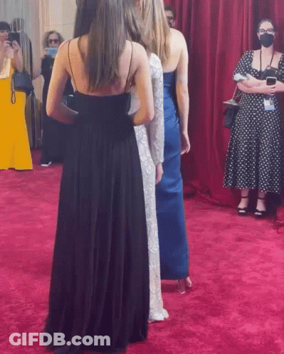 Women On Red Carpet One Wearing Mask GIF