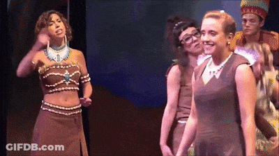 Women On Stage One Wearing Necklace With Letter A GIF