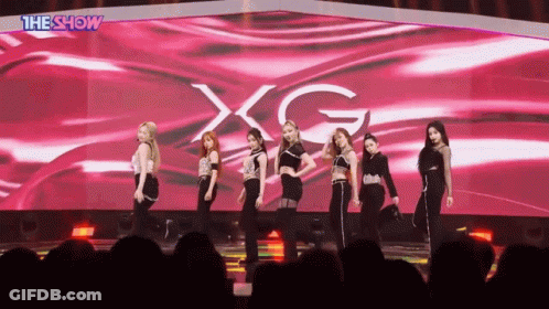 Women On Stage With XG Screen GIF