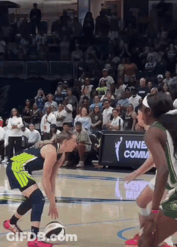 Women Playing Basketball In Front Of A Sign That Says Wnb Comm. GIF