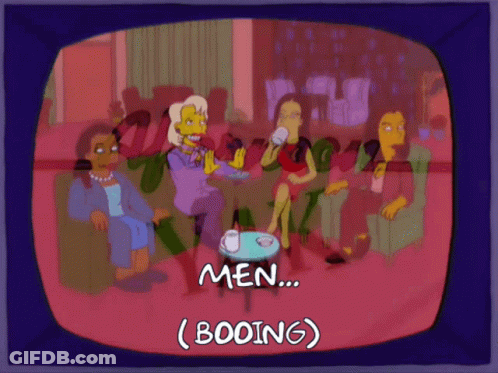 Women Sitting Around Table Booing Men GIF