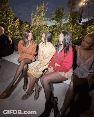 Women Sitting On Bench One In Red Jacket GIF