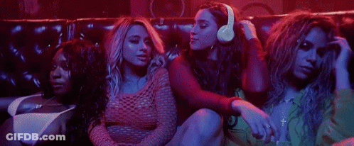 Women Sitting On Couch In Dark Room GIF
