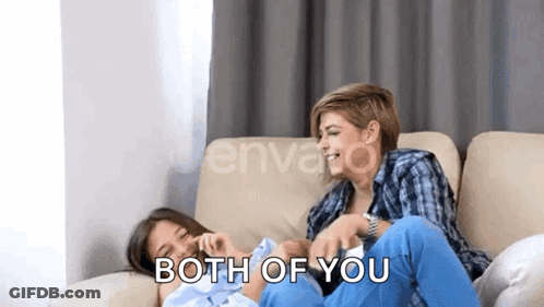 Women Sitting On Couch Laughing Baby GIF