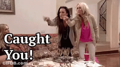 Women Sitting On Couch With Wine Glasses GIF