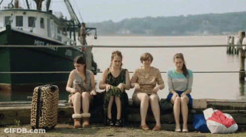 Women Sitting On Dock In Front Of Miss Valley Boat GIF