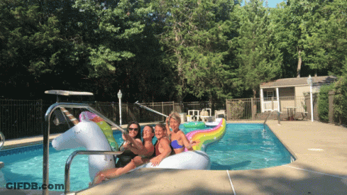 Women Sitting On Unicorn Float GIF