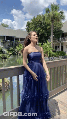 Women Standing In Dress Store GIF
