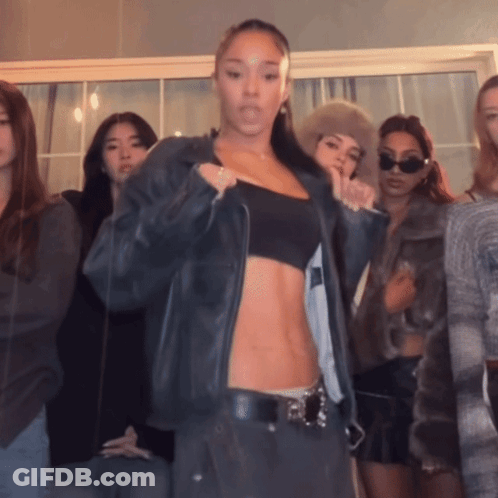 Women Standing In Front Of Mirror GIF