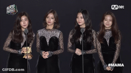 Women Standing In Front Of Mnet Sign GIF