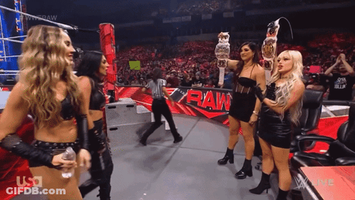 Women Standing In Front Of Raw Ring GIF