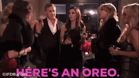 Women Standing In Room With Oreo GIF