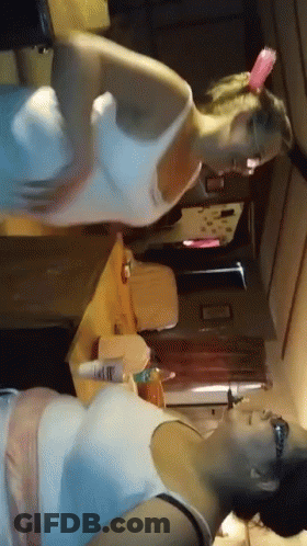Women Standing Next To Each Other GIF