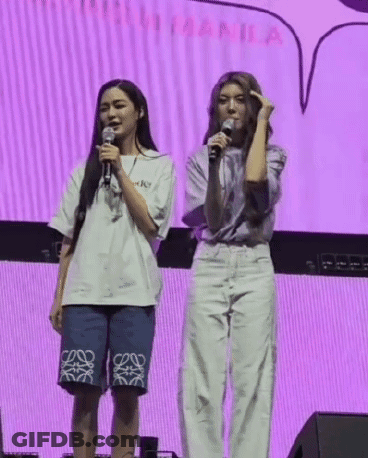 Women Standing On Stage With Microphones GIF
