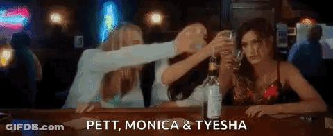 Women Toasting At Bar GIF