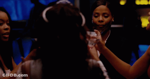 Women Toasting With Martinis In Dark Room GIF