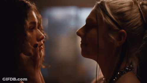 Women Touching Faces Looking At Each Other GIF