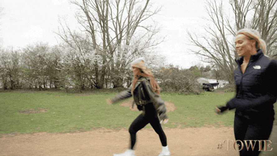 Women Walking Fast To Reach Finish Line GIF