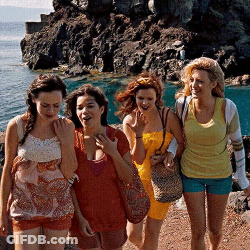 Women Walking Rocky Shoreline GIF
