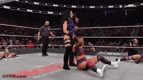 Women Wrestling In Ring With Peacock Logo GIF
