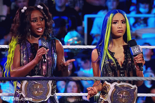 Women Wrestling Ring Holding Microphones GIF